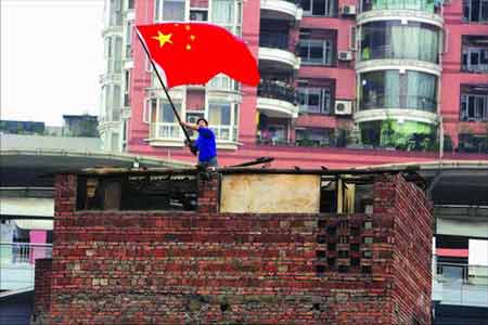 man waving chinese flag