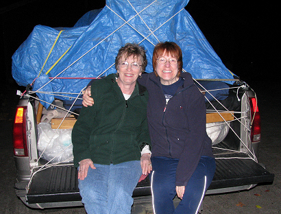 Lorelle and Lynda Kay VanFossen with a truck load of furniture from the Goodwill Outlet